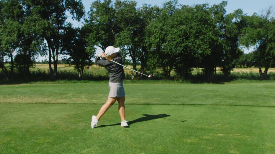 female golfer swing after shot image from hackmotion video