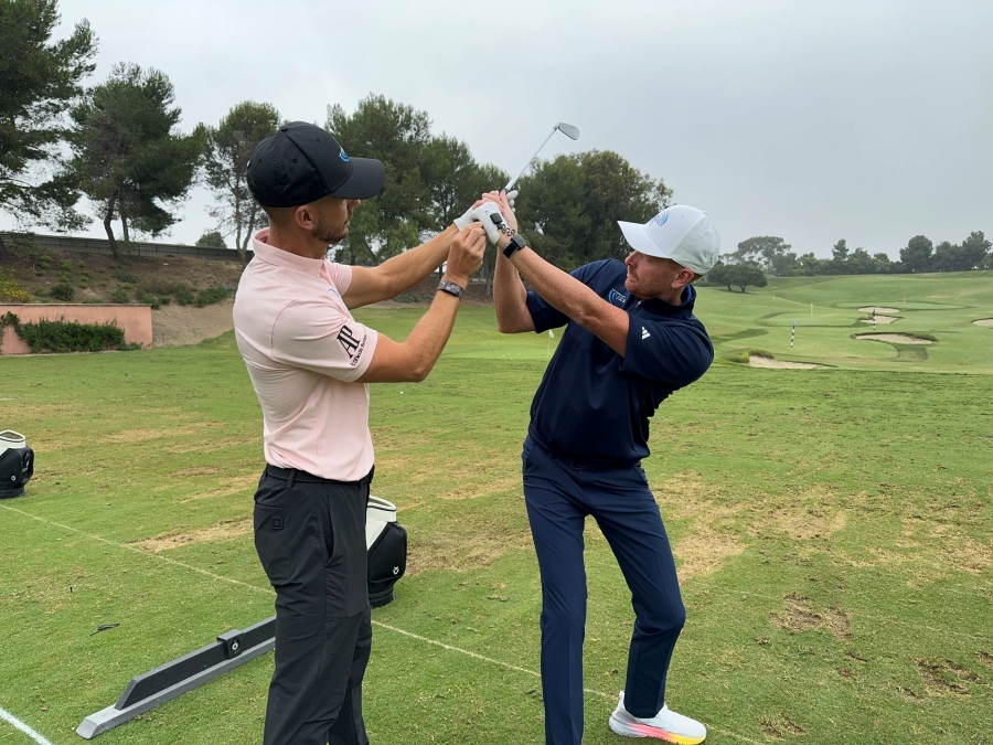 golf coach with student