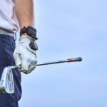 golf player wearing hackmotion wrist sensor closeup