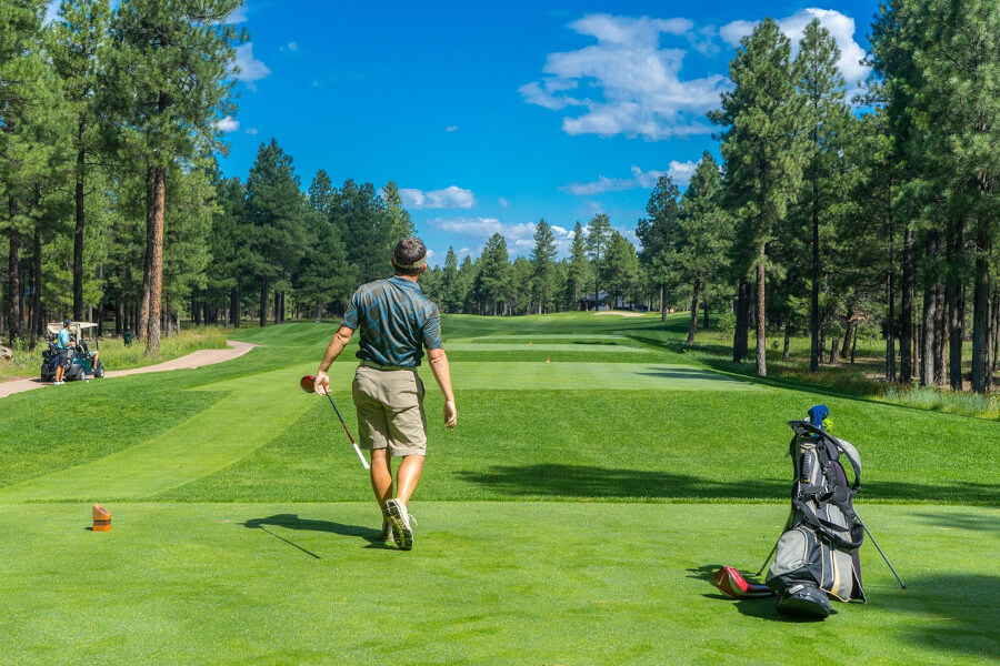 golfer at golf course practise shots