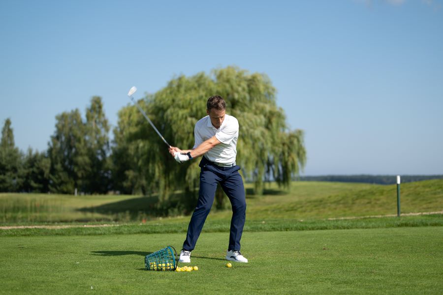 golfer on downswing position hitting shot