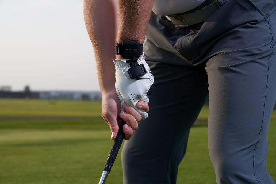 golfer on golf course wearing hackmotion swing analyzer