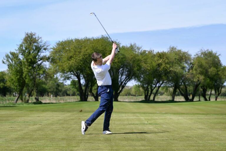 golfer release golf club after shot