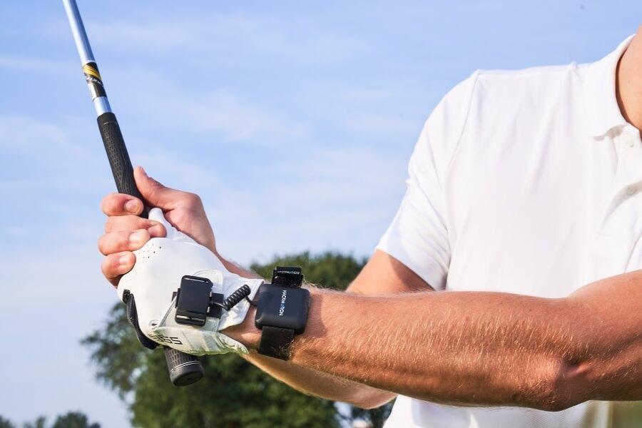 golfer wearing hackmotion sensor on swing takeaway