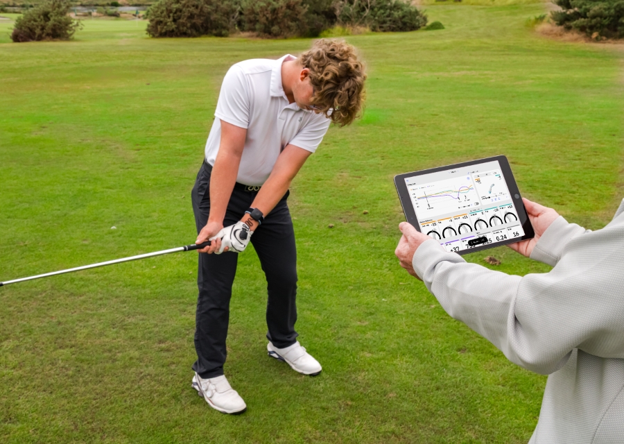 player training with hackmotion together with golf coach